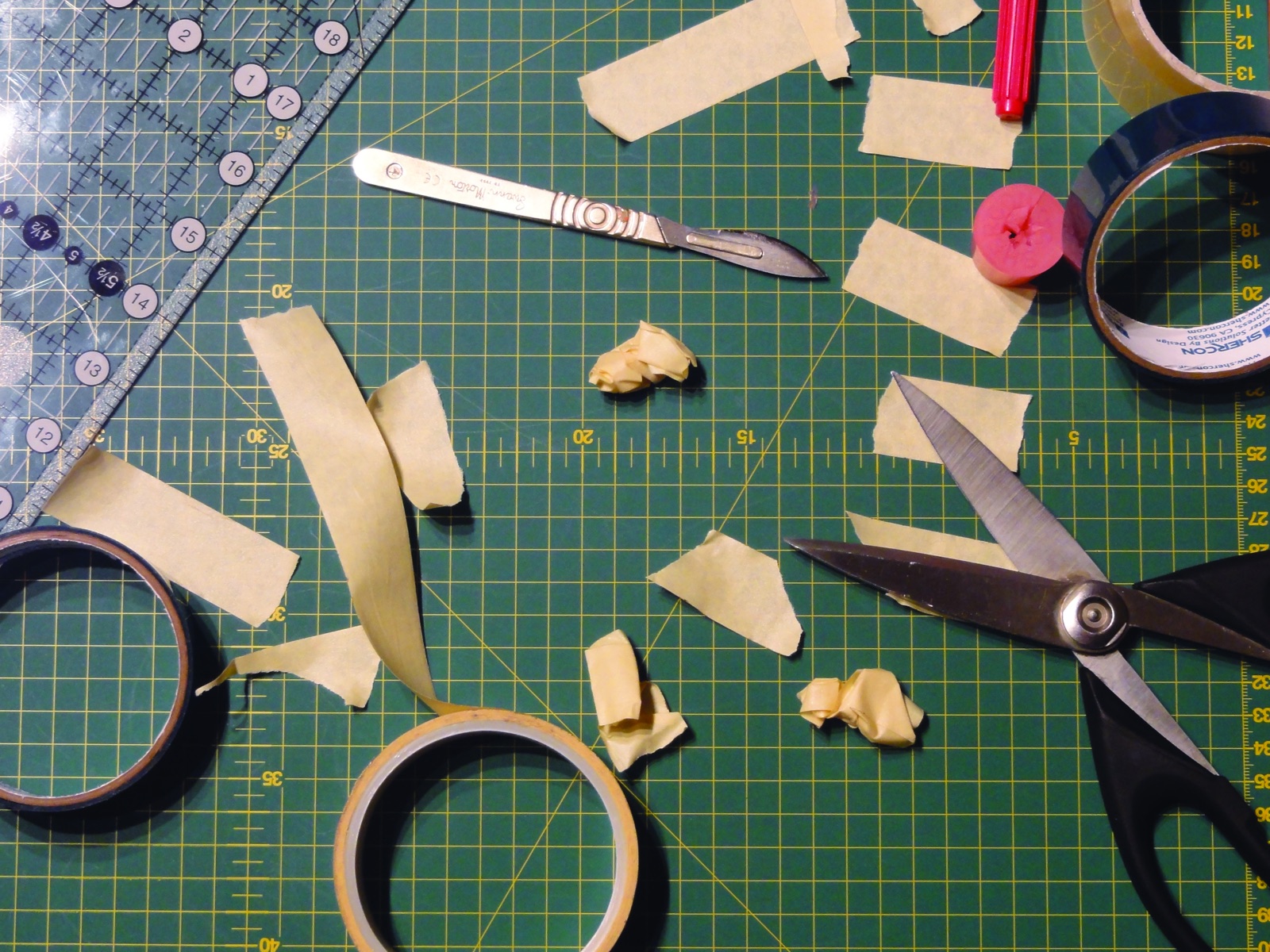 Manual masking bench with tape and cutting tools