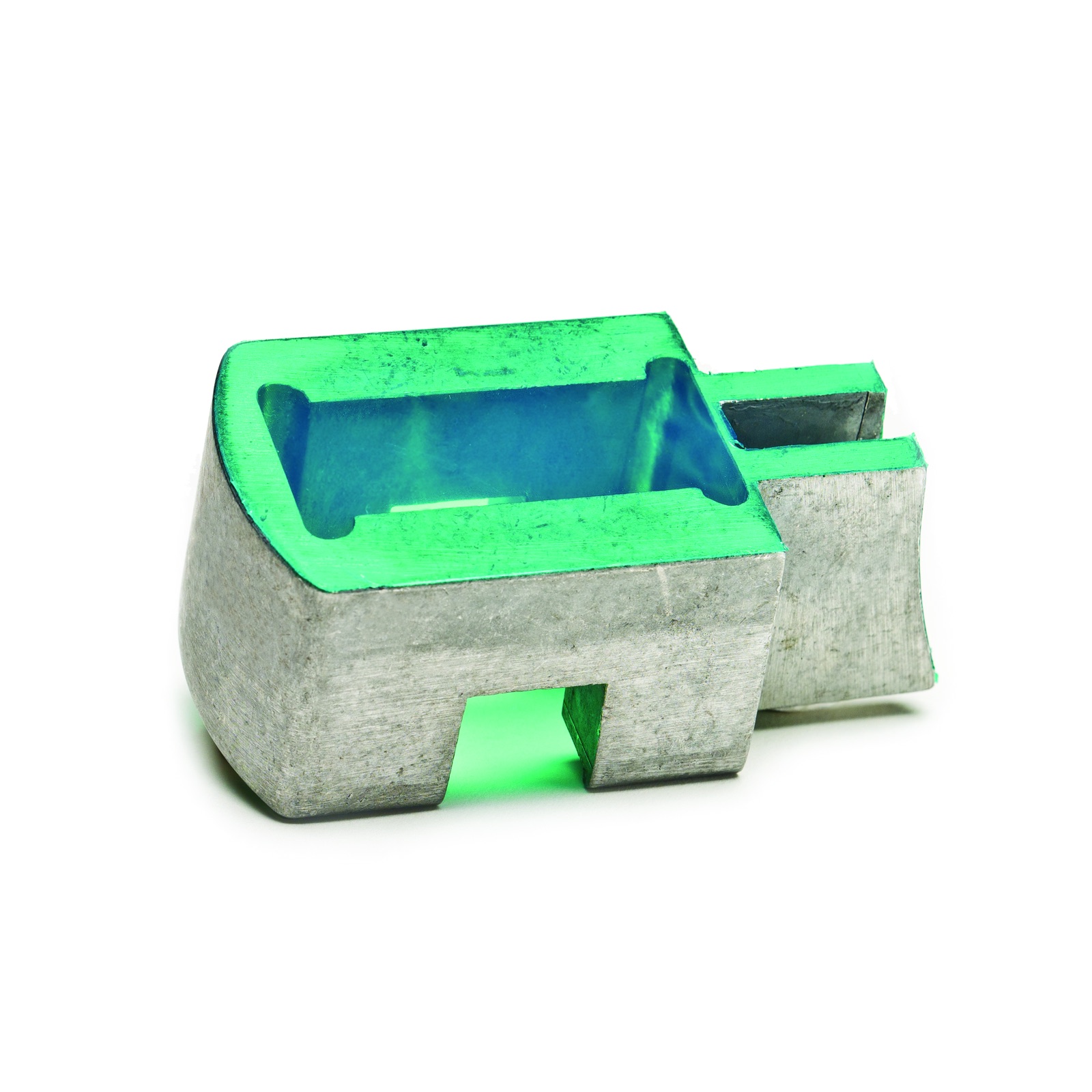 Pre-cut green masking shape applied to a metal part
